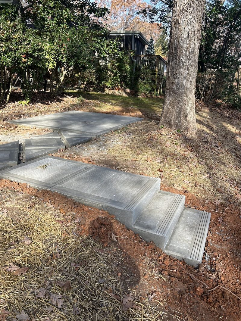 New concrete steps and patio pad in residential backyard in Spartanburg SC