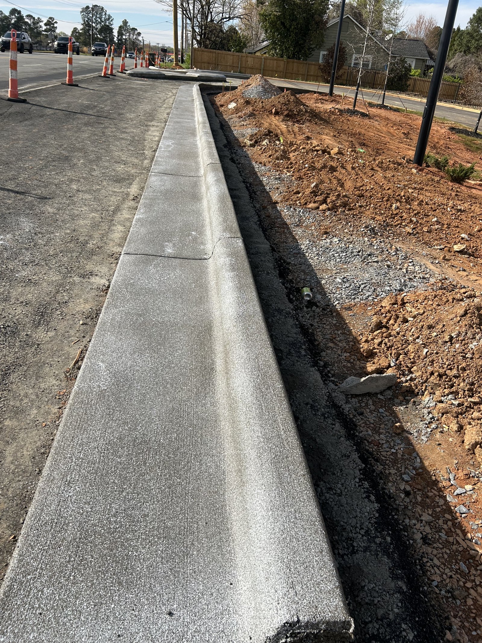 Newly installed concrete curb and gutter along road construction in Spartanburg SC