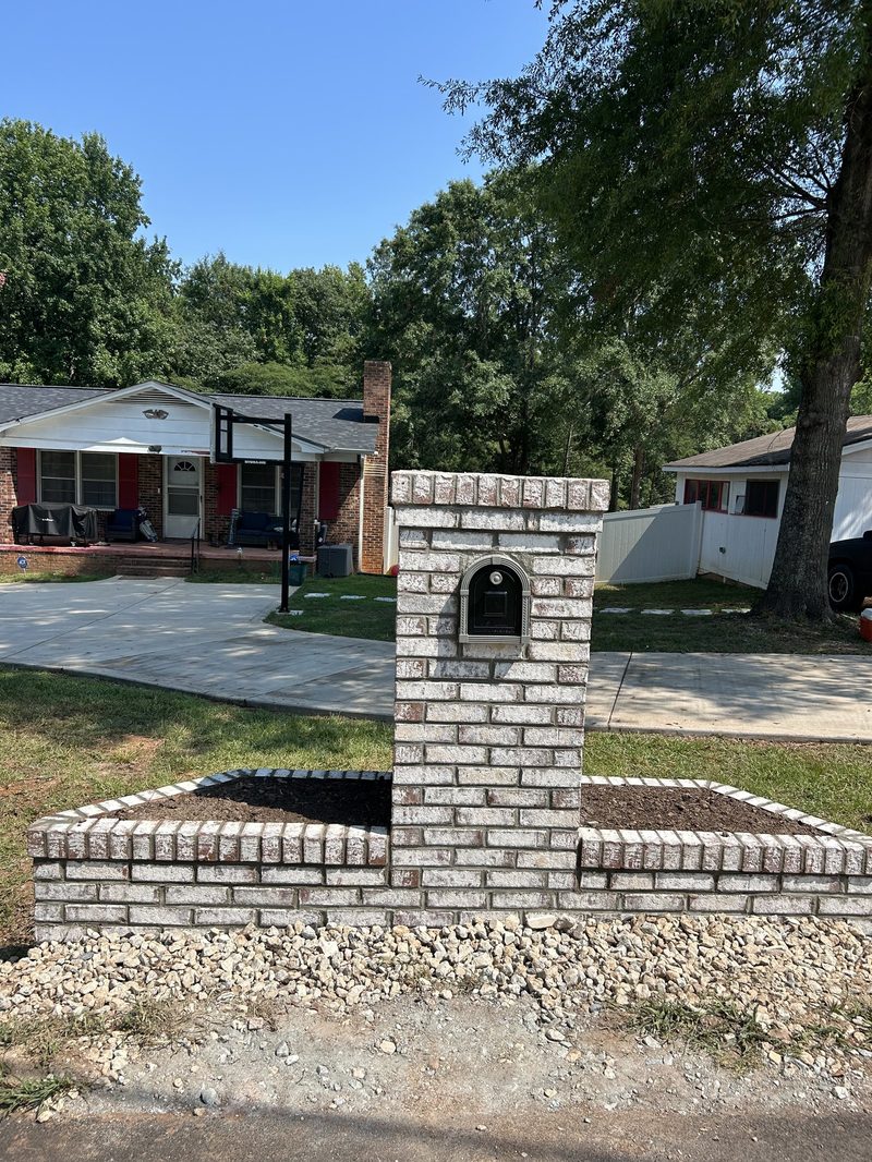 Residential concrete driveway with brick mailbox in Spartanburg SC